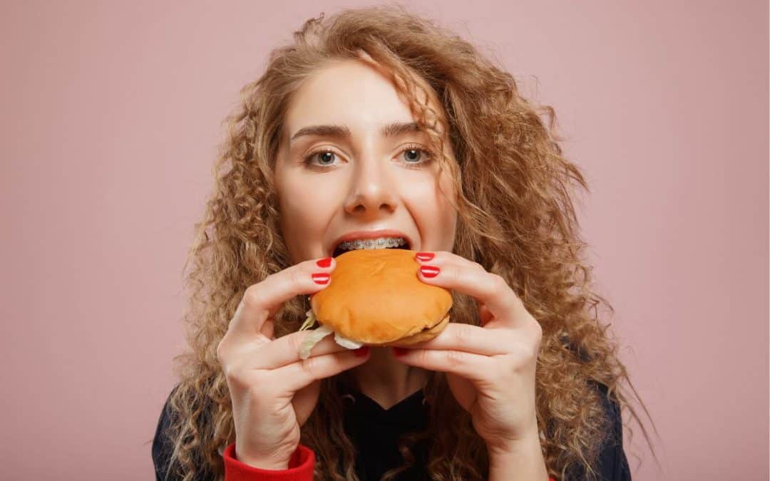 Helpful Fowler Orthodontics Tips & Info 140 Woman eating sandwich with braces