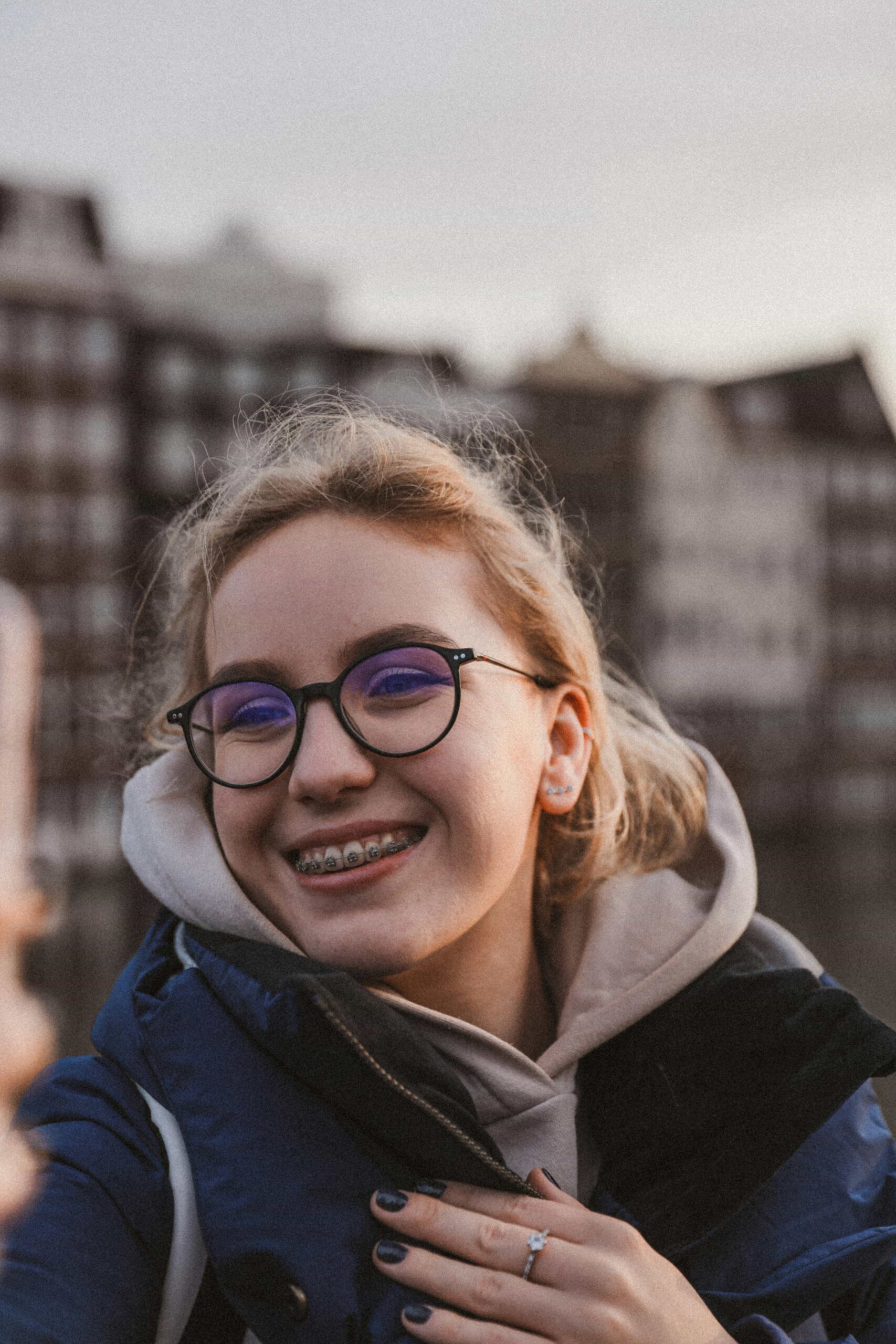 Helpful Fowler Orthodontics Tips & Info 114 young woman outside wearing braces