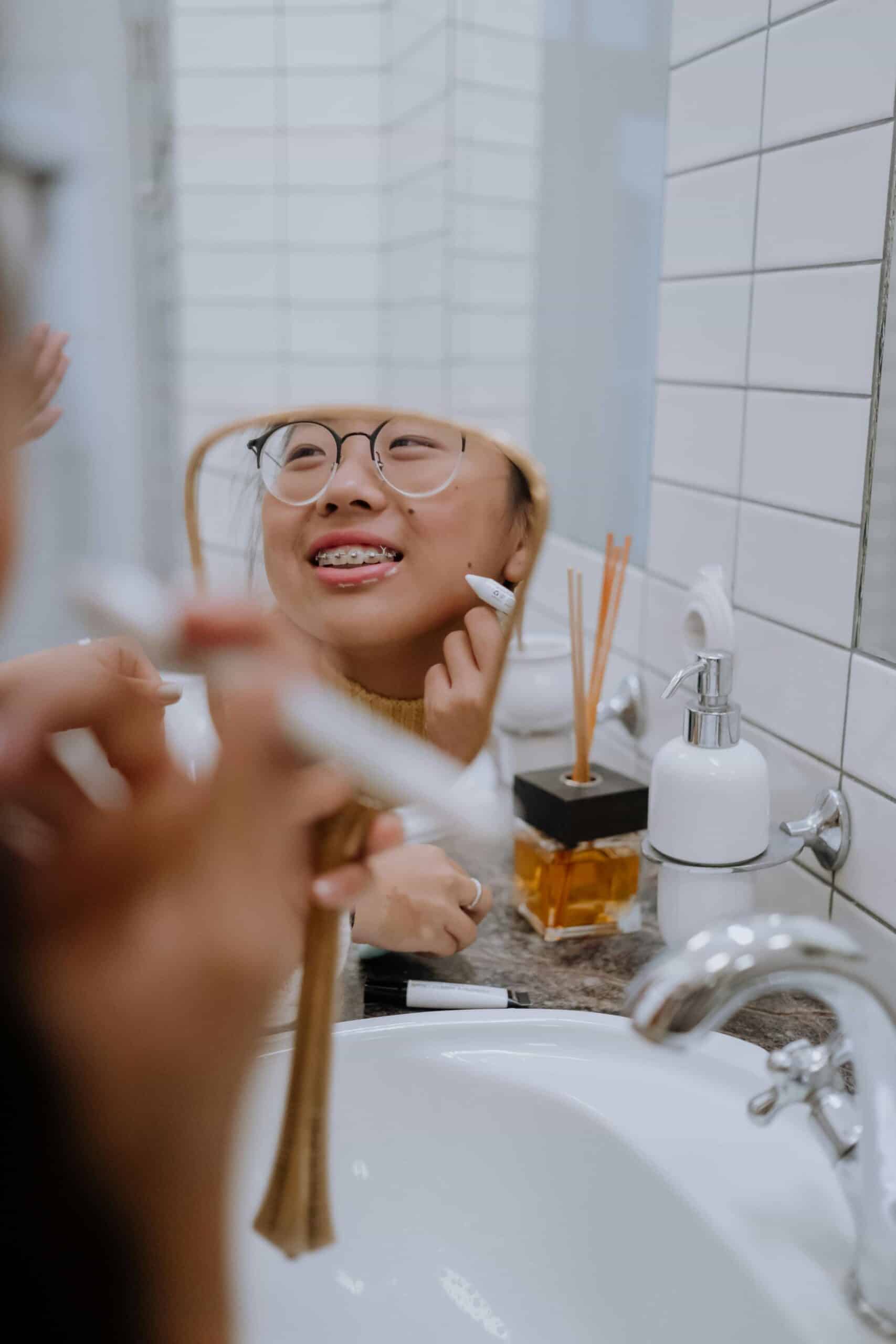 Helpful Fowler Orthodontics Tips & Info 110 girl with braces looking in mirror